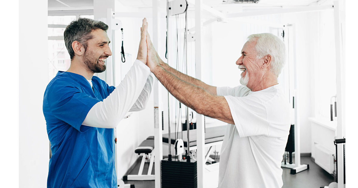 Neurological Physiotherapist encouraging patient at the gym.