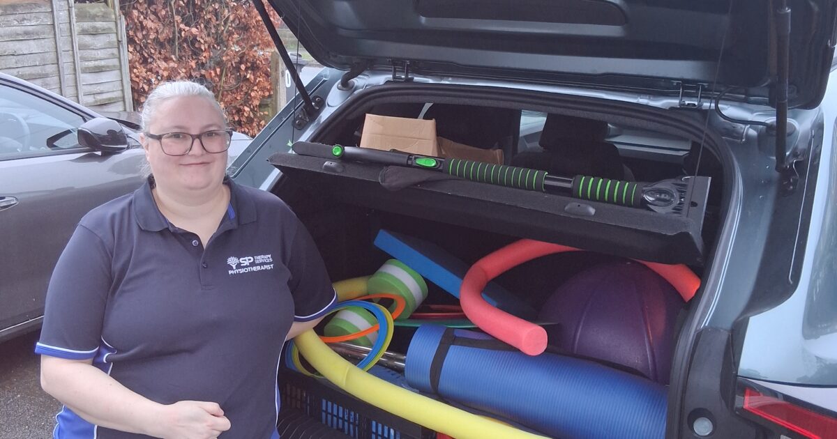 Neuro physio home visits Bradford – physiotherapist Rebecca Dickson with car boot full of rehabilitation equipment for home sessions